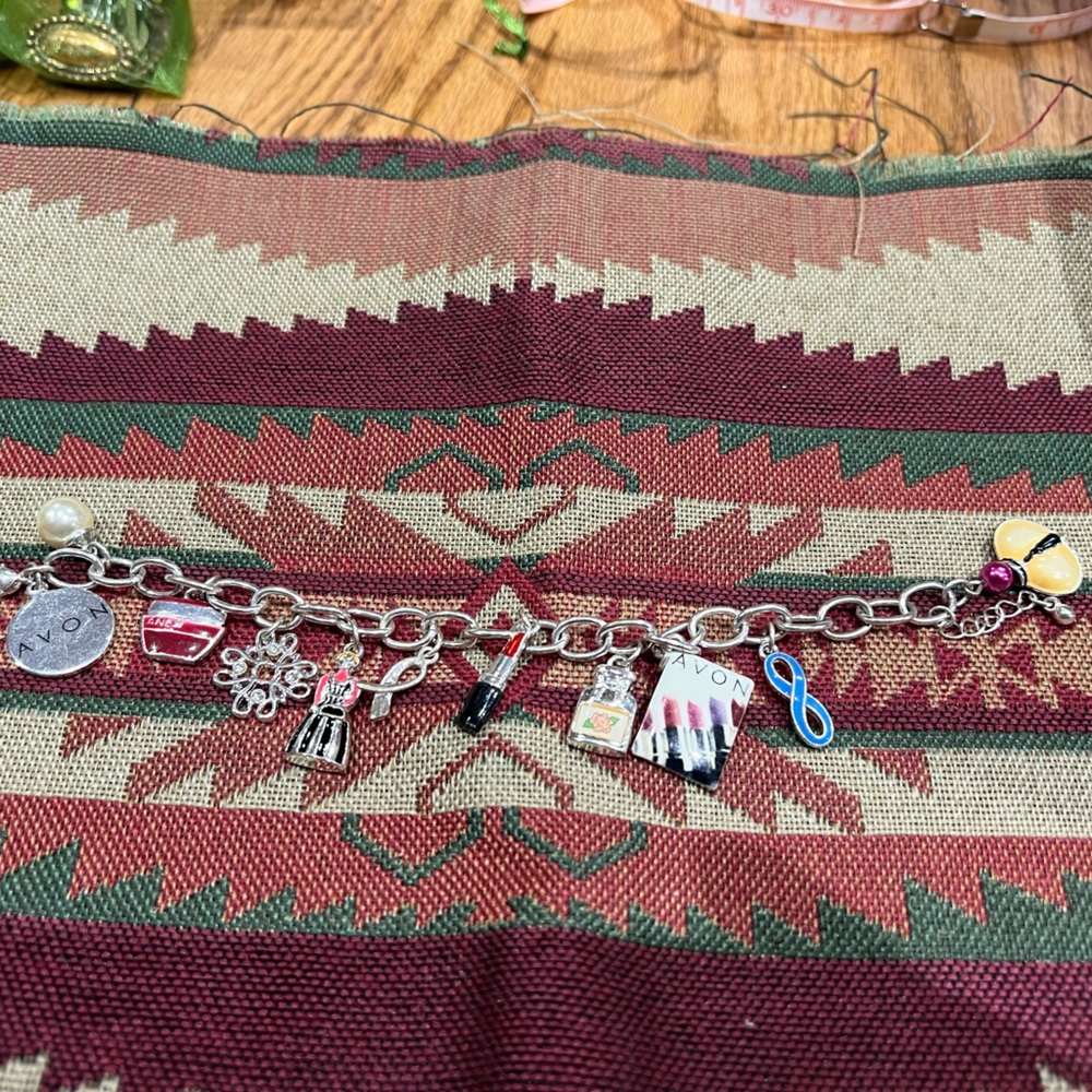 Avon charm bracelet. Given our as award.